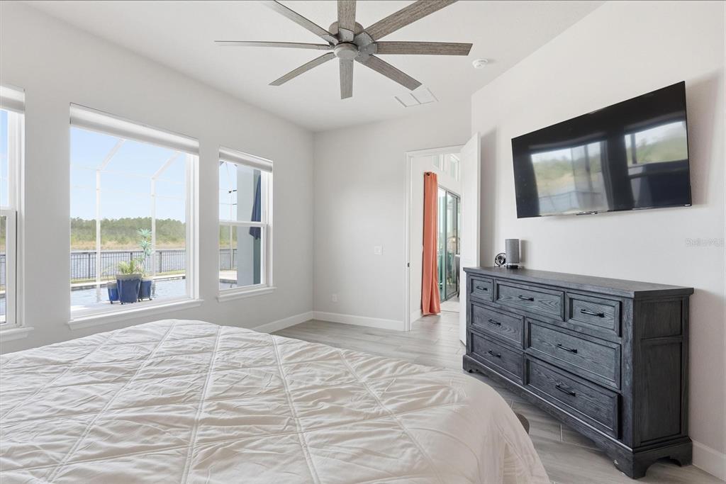 270 Azure Mist Way Daytona Beach, FL 32124 - Photo 27 of 71 a bedroom with a large bed and a flat screen tv