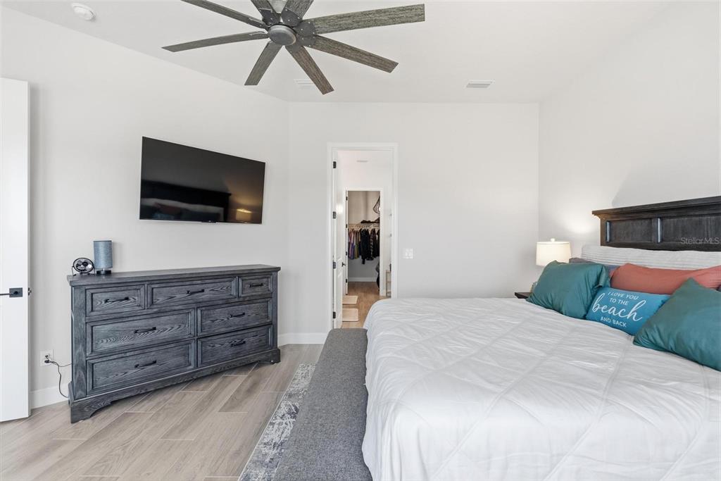 270 Azure Mist Way Daytona Beach, FL 32124 - Photo 28 of 71 a bedroom with a large bed and a flat screen tv