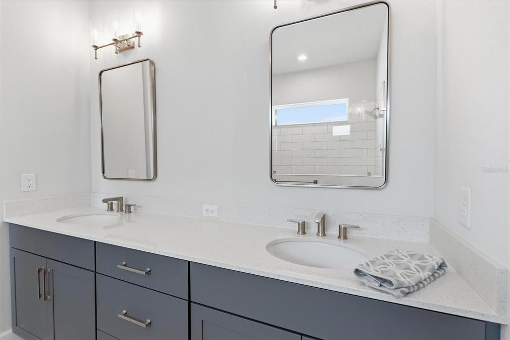 270 Azure Mist Way Daytona Beach, FL 32124 - Photo 32 of 71 a bathroom with a sink and a mirror