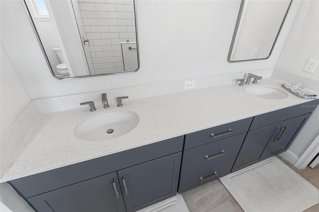 270 Azure Mist Way Daytona Beach, FL 32124 - Photo 33 of 71 a bathroom with a sink vanity and a mirror