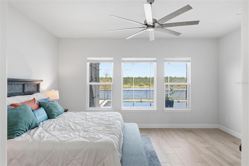 270 Azure Mist Way Daytona Beach, FL 32124 - Photo 37 of 71 a bedroom with a large bed and a window