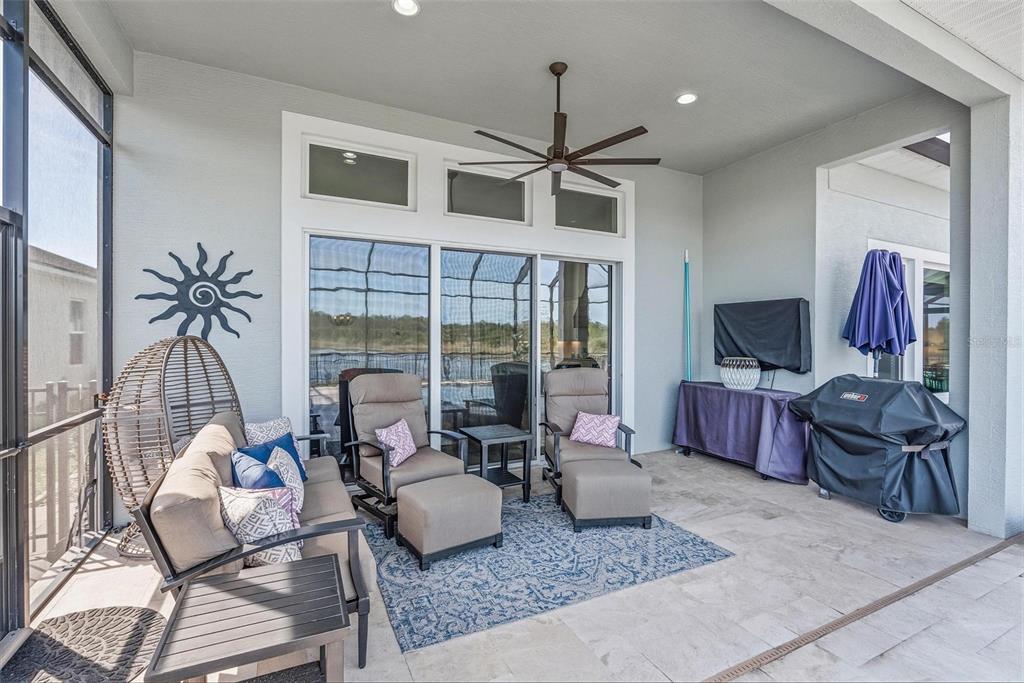 270 Azure Mist Way Daytona Beach, FL 32124 - Photo 40 of 71 a living room with furniture a flat screen tv and a large window