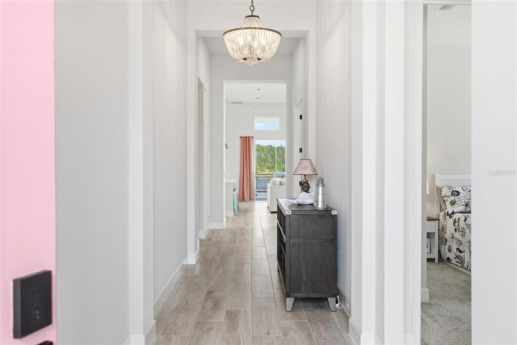 270 Azure Mist Way Daytona Beach, FL 32124 - Photo 4 of 71 a view of a hallway with wooden floor windows and livingroom view