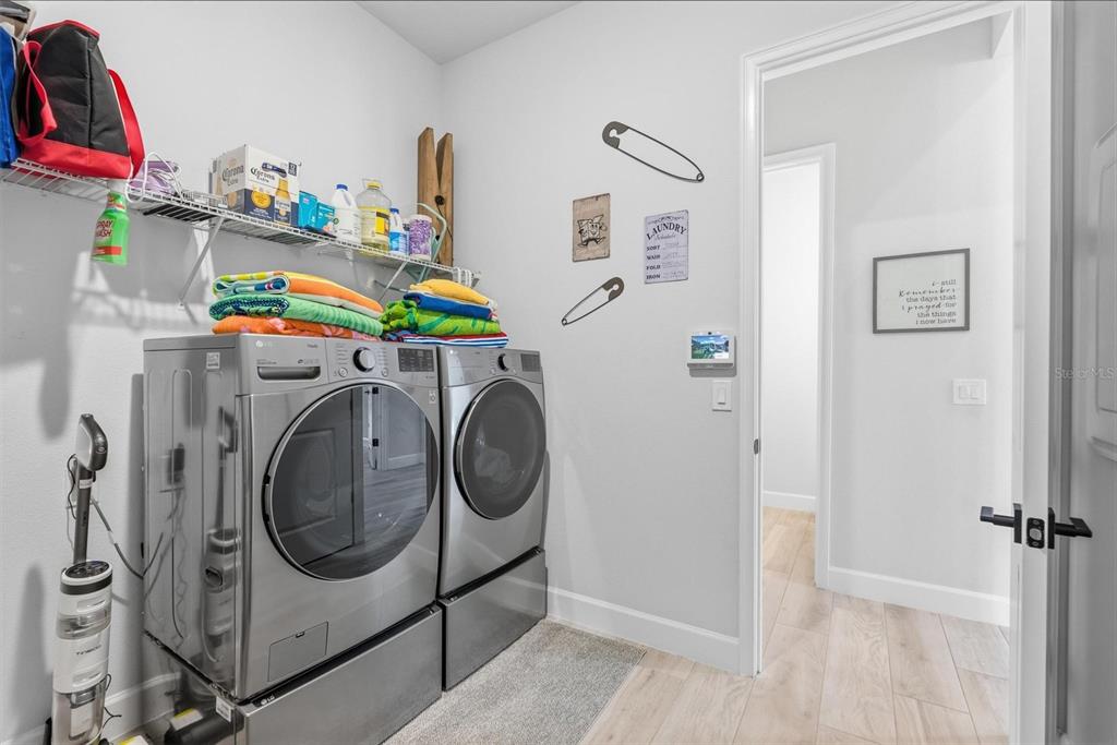 270 Azure Mist Way Daytona Beach, FL 32124 - Photo 50 of 71 a utility room with dryer and washer