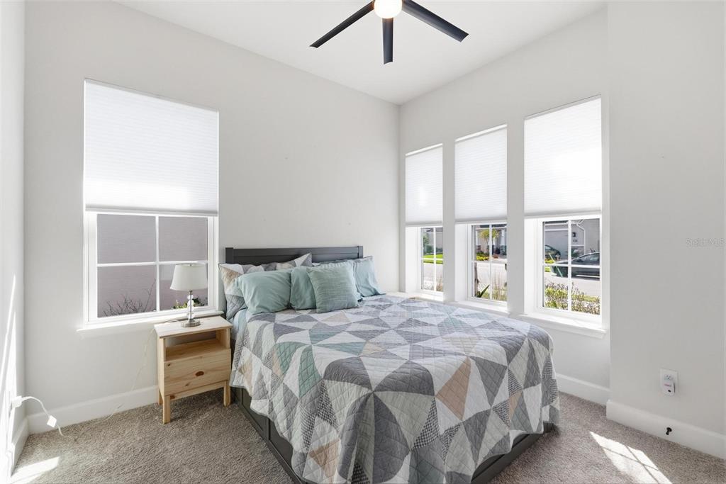 270 Azure Mist Way Daytona Beach, FL 32124 - Photo 53 of 71 a bedroom with a bed and a large window