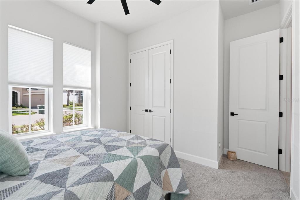 270 Azure Mist Way Daytona Beach, FL 32124 - Photo 54 of 71 a bedroom with a bed and a large window