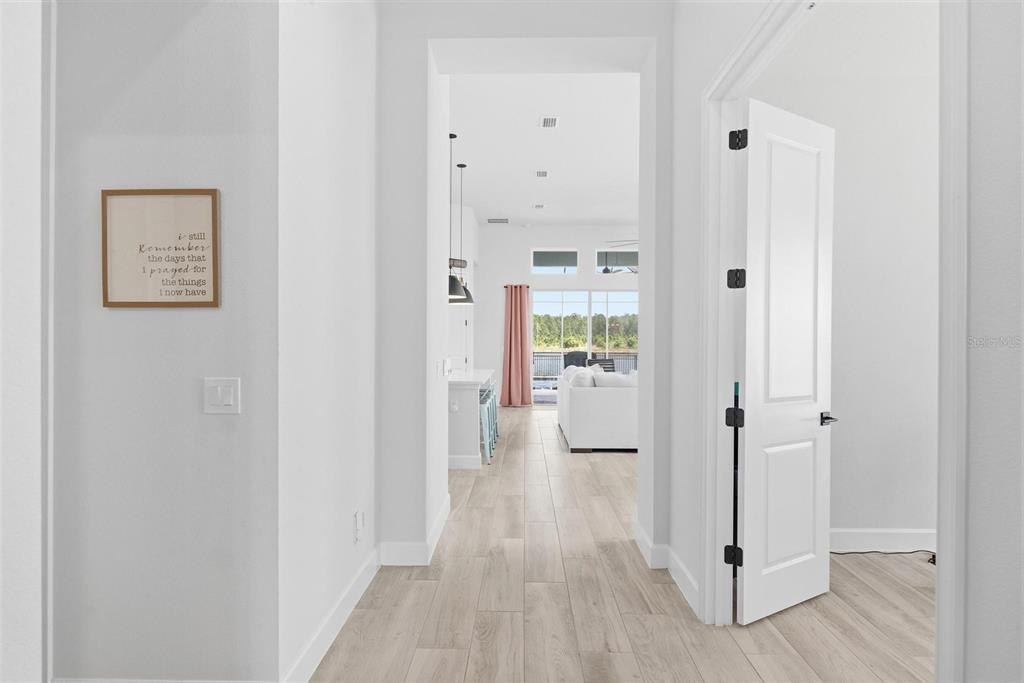 270 Azure Mist Way Daytona Beach, FL 32124 - Photo 6 of 71 a view of a hallway with wooden floor