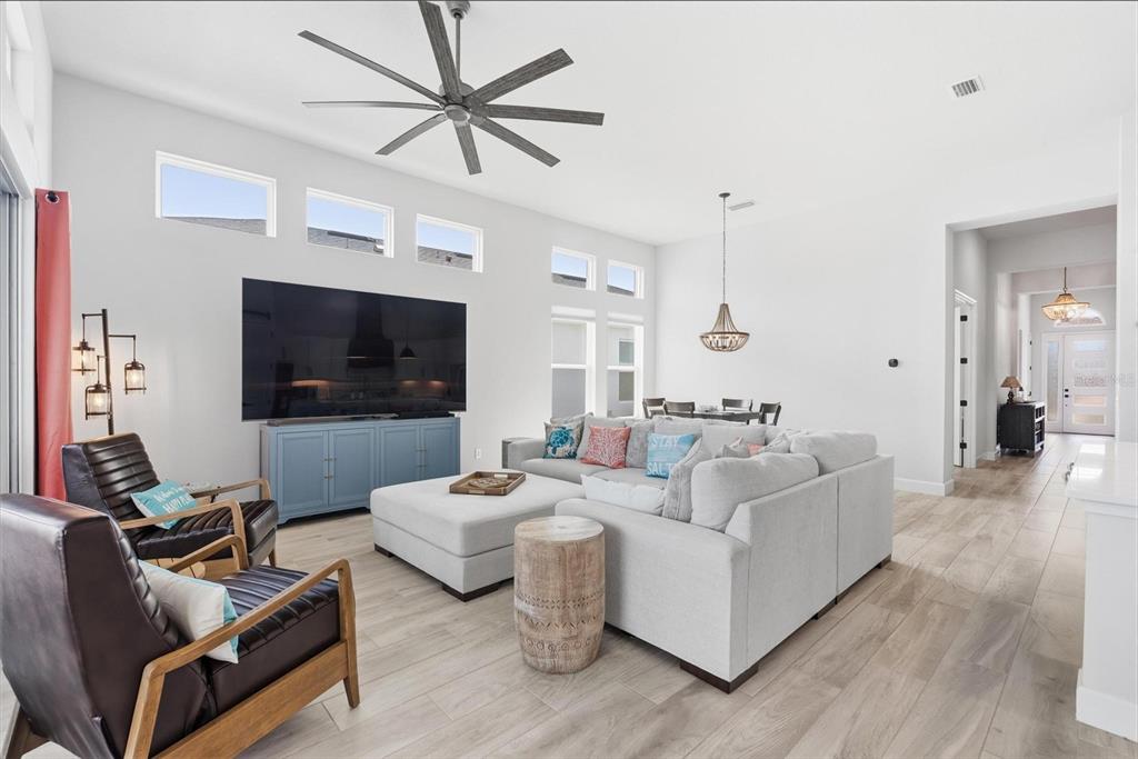 270 Azure Mist Way Daytona Beach, FL 32124 - Photo 7 of 71 a living room with furniture and a flat screen tv