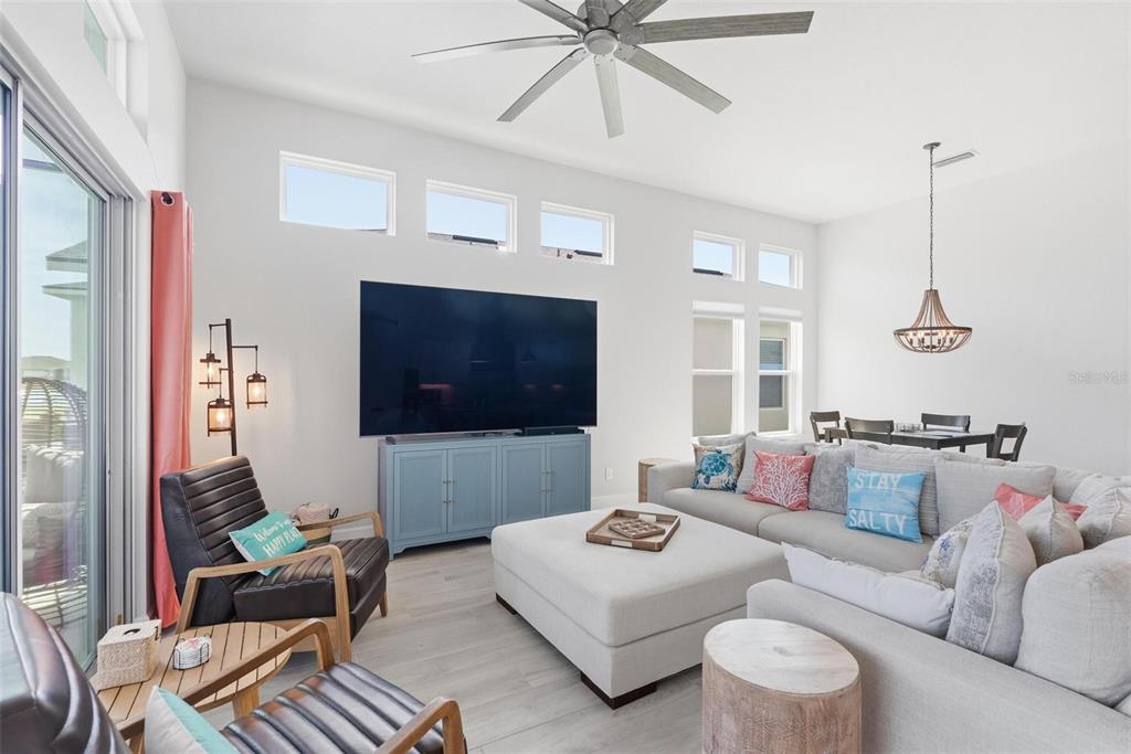 270 Azure Mist Way Daytona Beach, FL 32124 - Photo 10 of 71 a living room with furniture and a flat screen tv