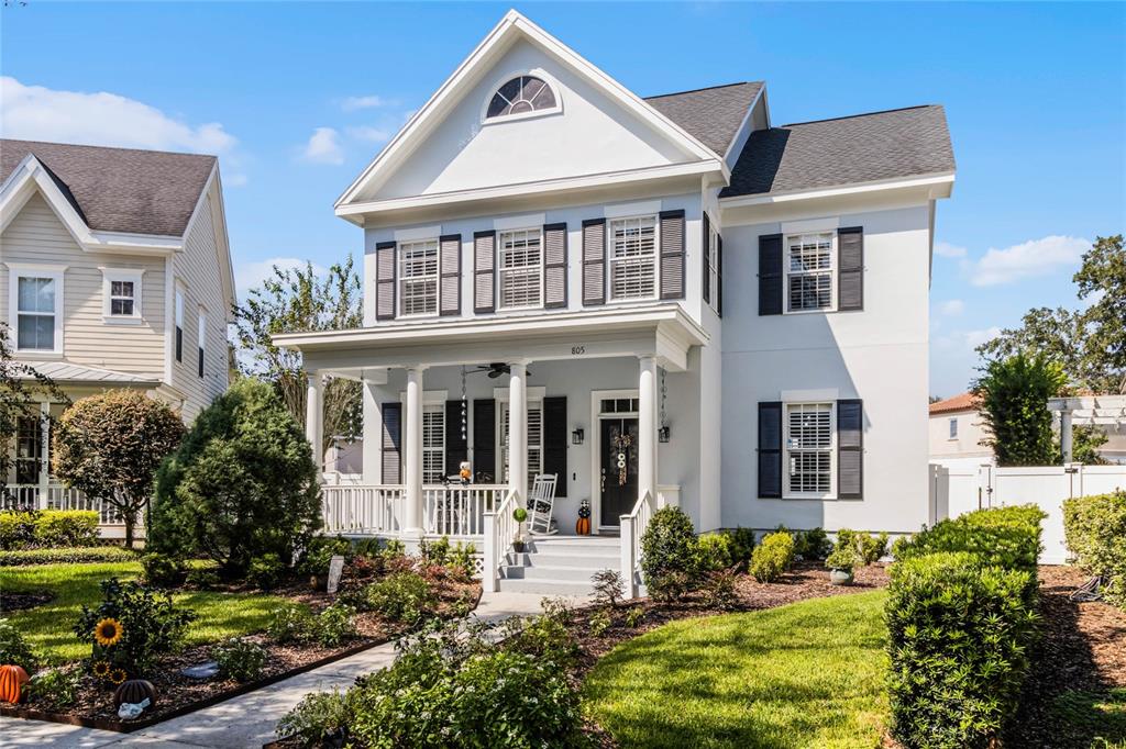 805 Veranda Place Celebration, FL 34747 - Photo 1 of 1 a front view of a house with garden