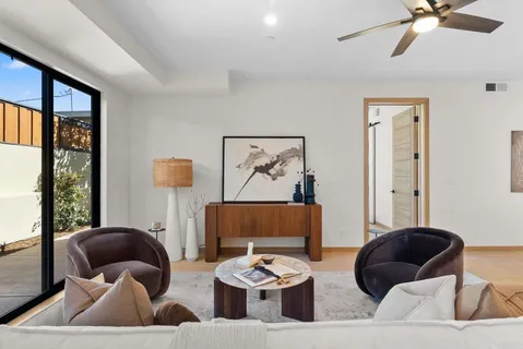 a living room with furniture and a large window
