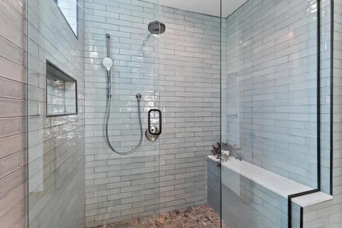 a view of bathroom with a toilet sink and a mirror