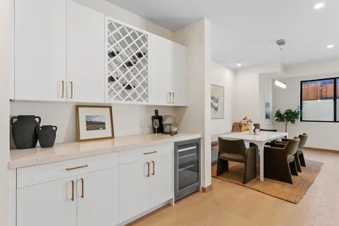 a dining room with a table and chairs