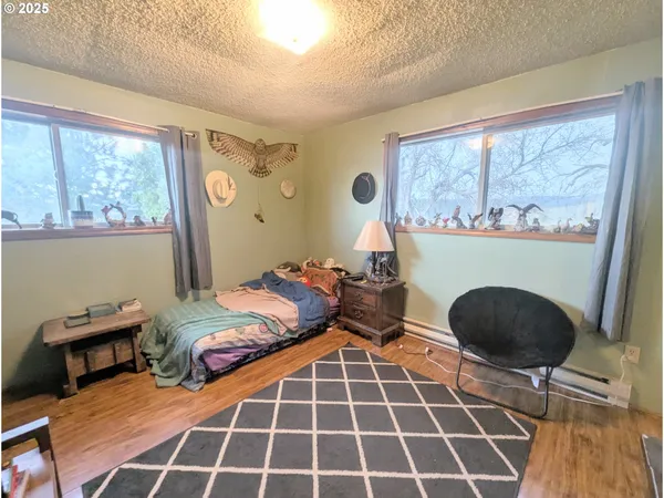 a living room with fireplace furniture and a flat screen tv