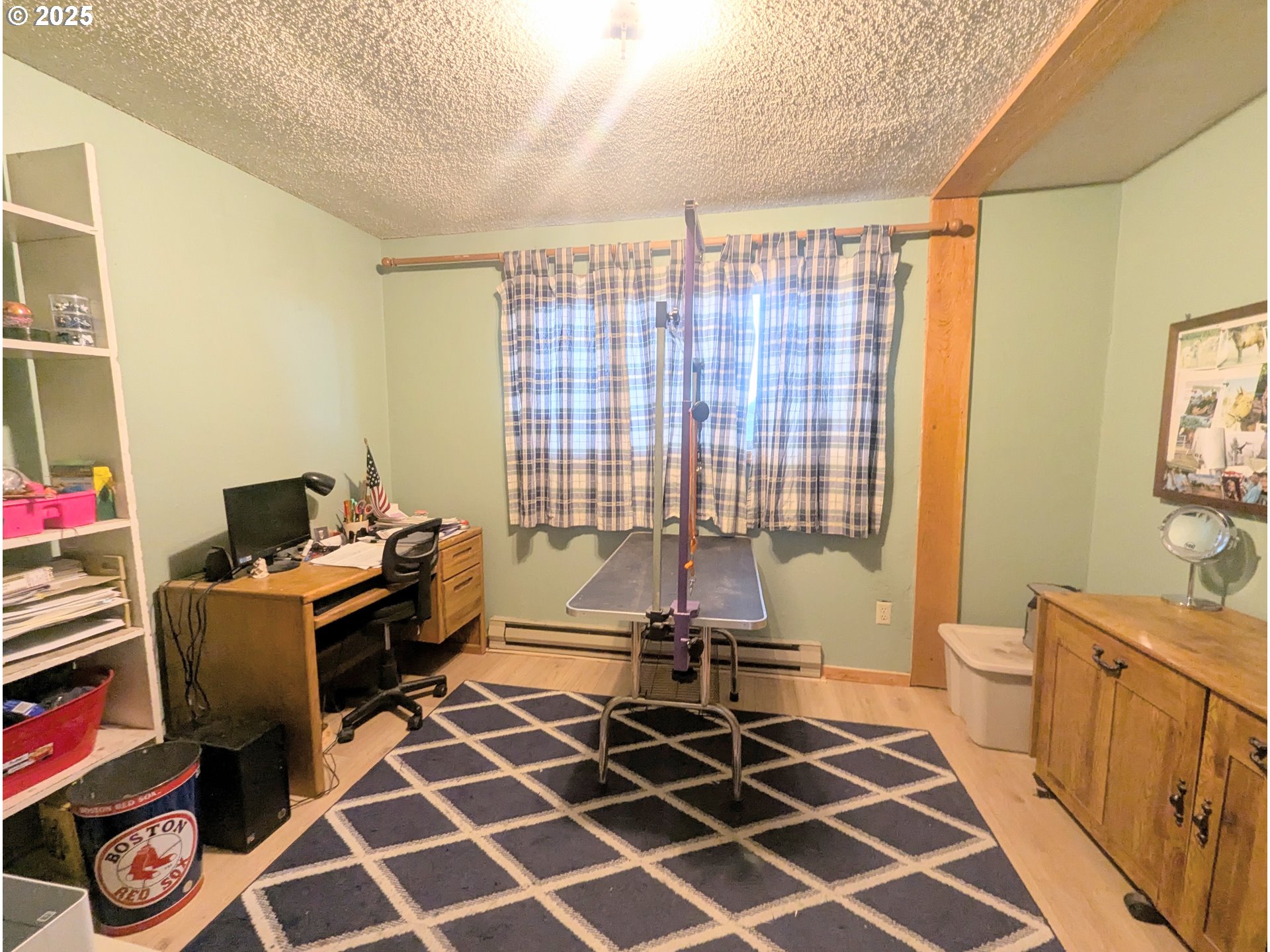 71564 Palmer Junction Road Elgin, OR 97827 - Photo 37 of 40 a view of a workspace with furniture and a window