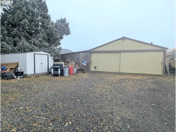 a view of garage and small cabin