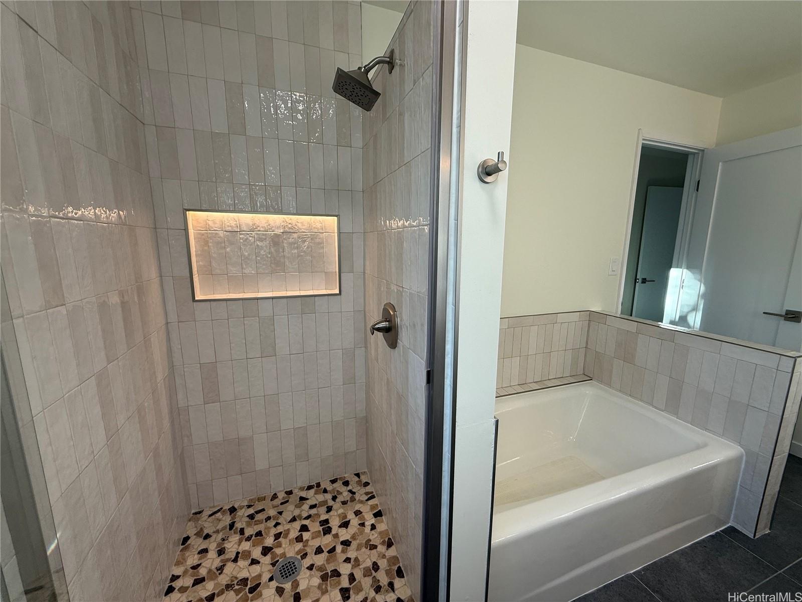 92-1274 Palahia Street Kapolei, HI 96707 - Photo 7 of 11 a bathroom with a bathtub and shower