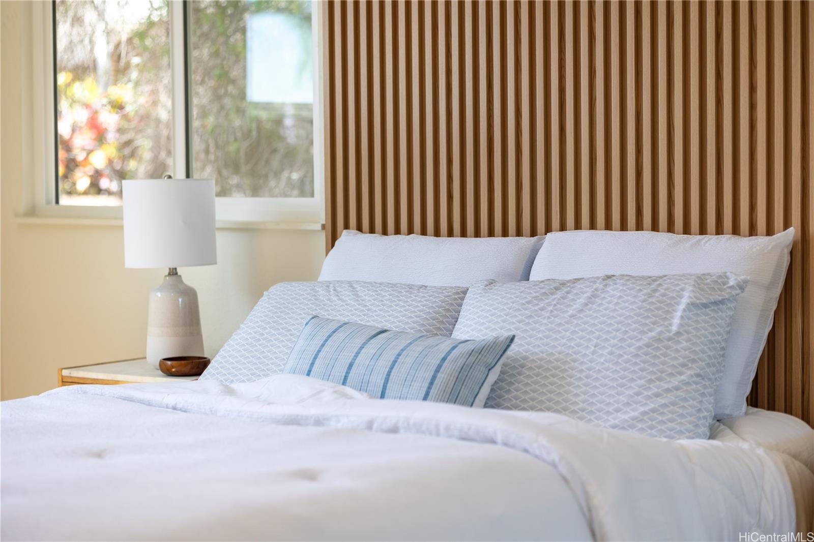 92-1274 Palahia Street Kapolei, HI 96707 - Photo 9 of 11 a bedroom with a large bed and a large window