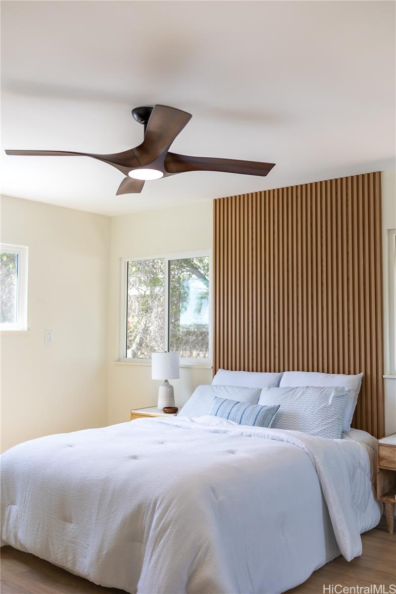 92-1274 Palahia Street Kapolei, HI 96707 - Photo 10 of 11 a bedroom with a large bed and a large window
