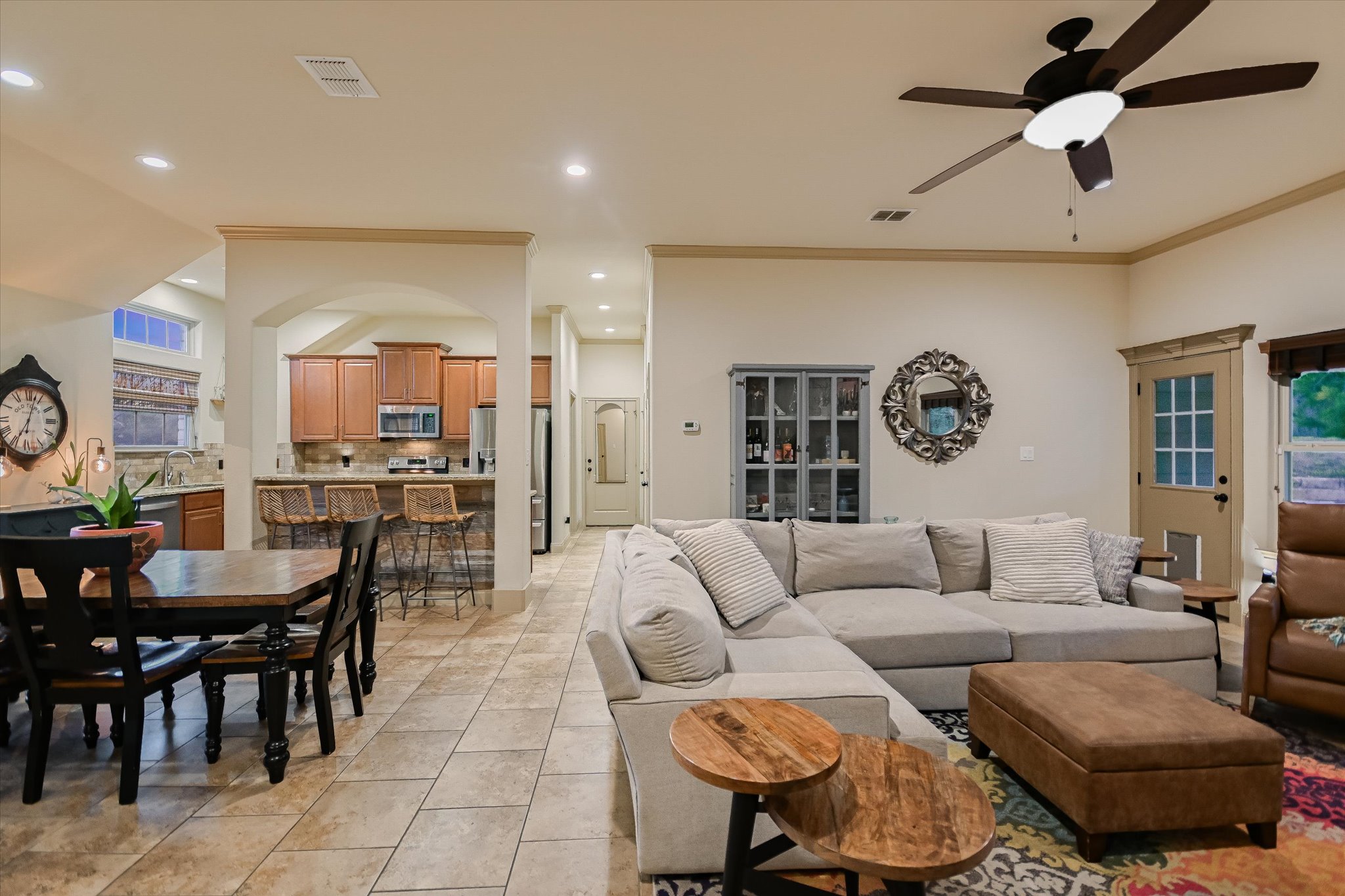 36 Ridgewood Circle Wimberley, TX 78676 - Photo 9 of 30 Arched transitions and tile flooring define this inviting, open-concept living space.