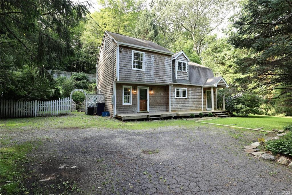 213 New Canaan Road Wilton, CT 06897 - Photo 1 of 1 a backyard of a house and trees