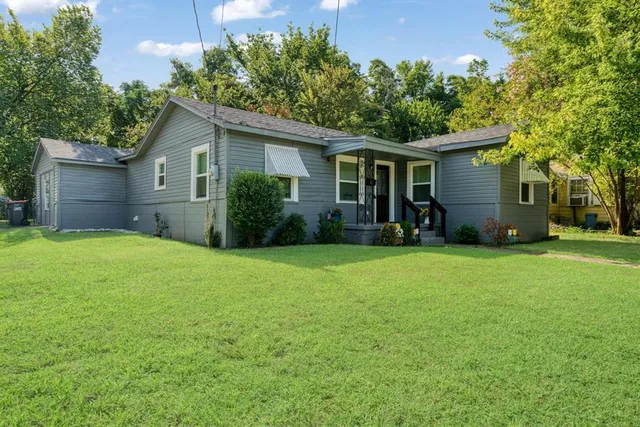 front view of a house with a yard