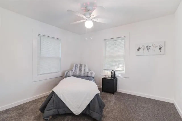 a bedroom with a bed and cabinets