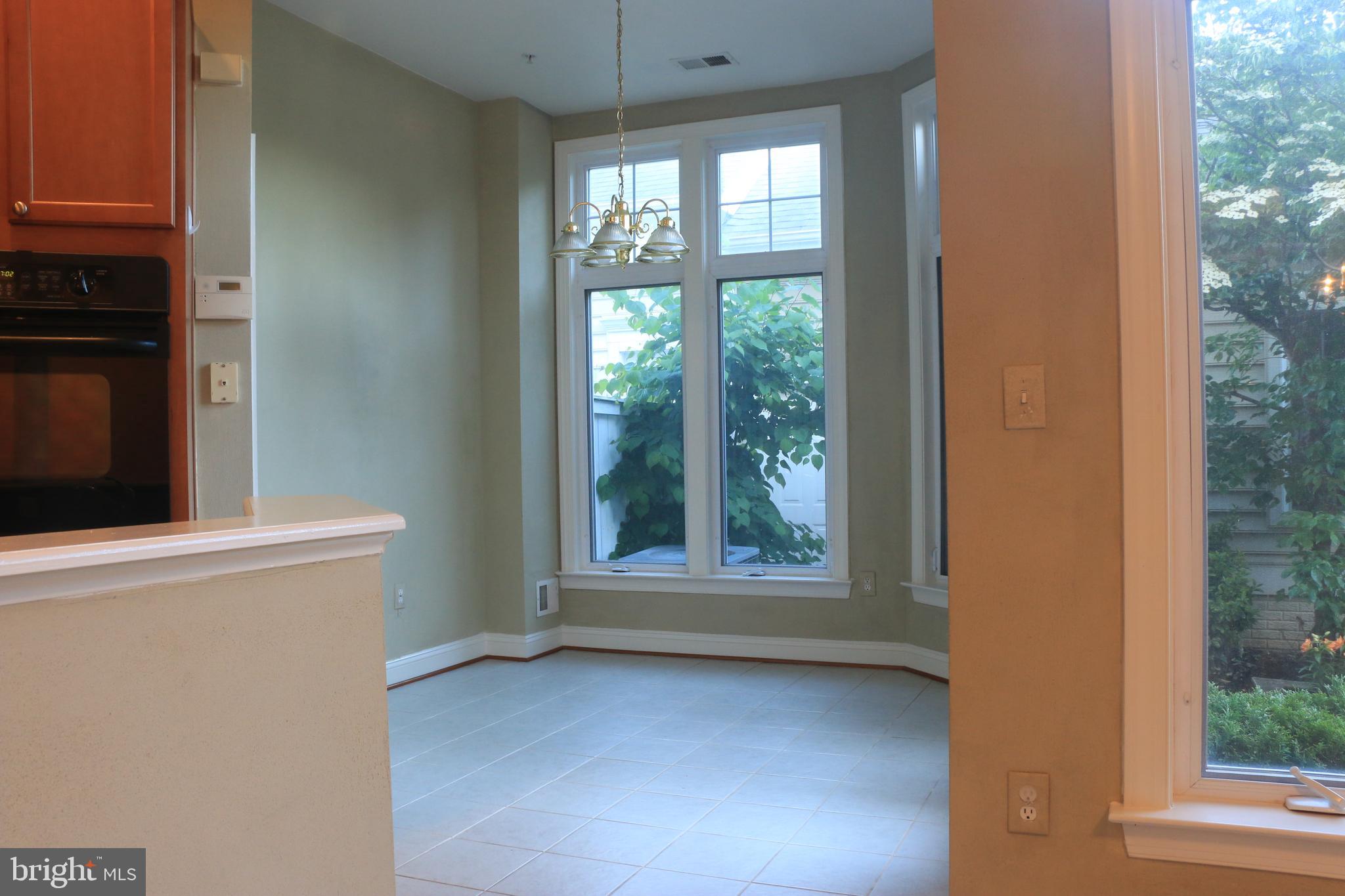 714 Ridgemont Avenue Rockville, MD 20850 - Photo 13 of 46 Breakfast area w/door access to patio backyard