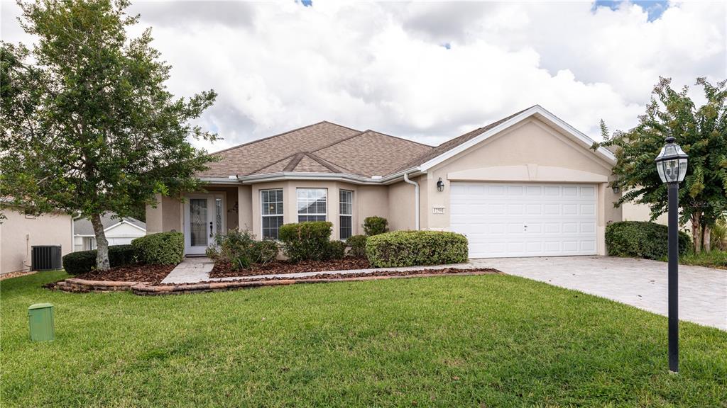 12591 Southeast 97th Terrace Road Summerfield, FL 34491 - Photo 1 of 1 Exterior with fresh landscaping