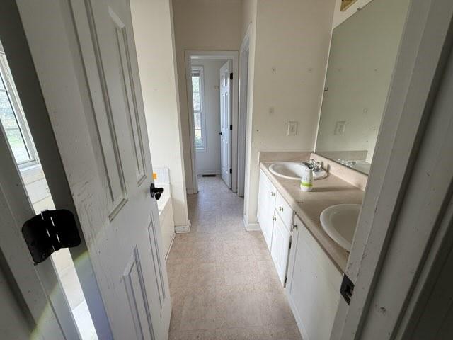 102 Twilight Court Jackson, GA 30233 - Photo 3 of 12 a bathroom with double vanity sink and mirror