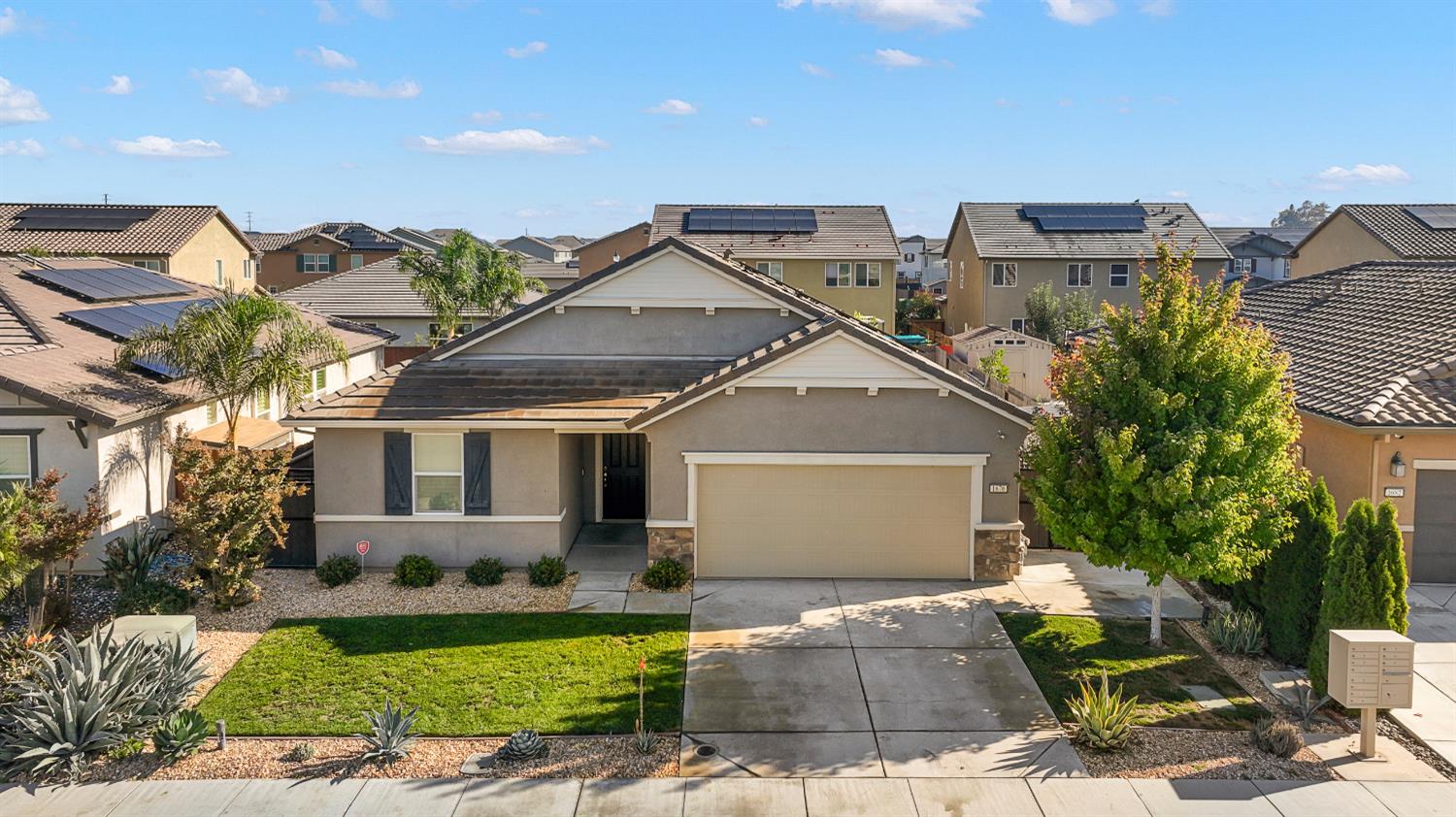 1676 Red Ribbons Lane Manteca, CA 95337 - Photo 2 of 33 a front view of a house with garden