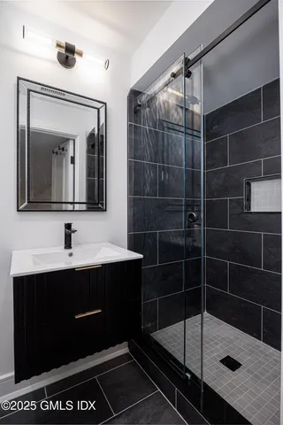 a bathroom with a sink and mirror