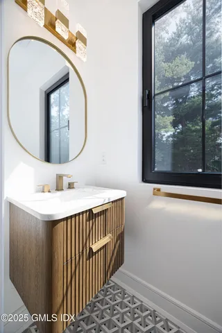a bathroom with a sink and a mirror