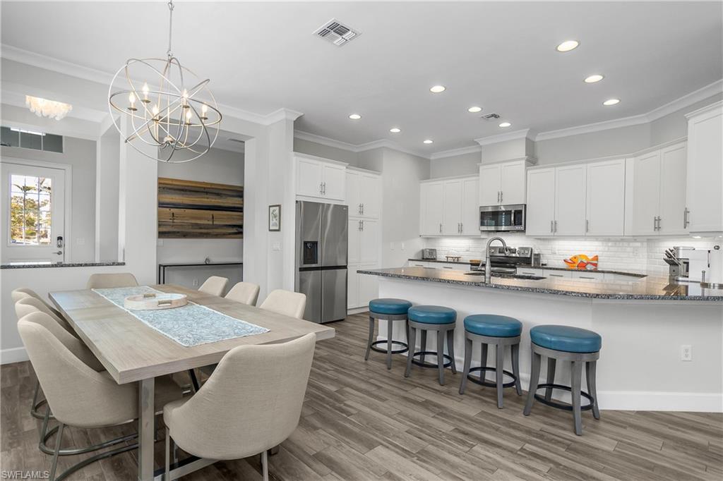 6907 Cay Court Naples, FL 34113 - Photo 21 of 50 Another View of the Kitchen and Dining Areas