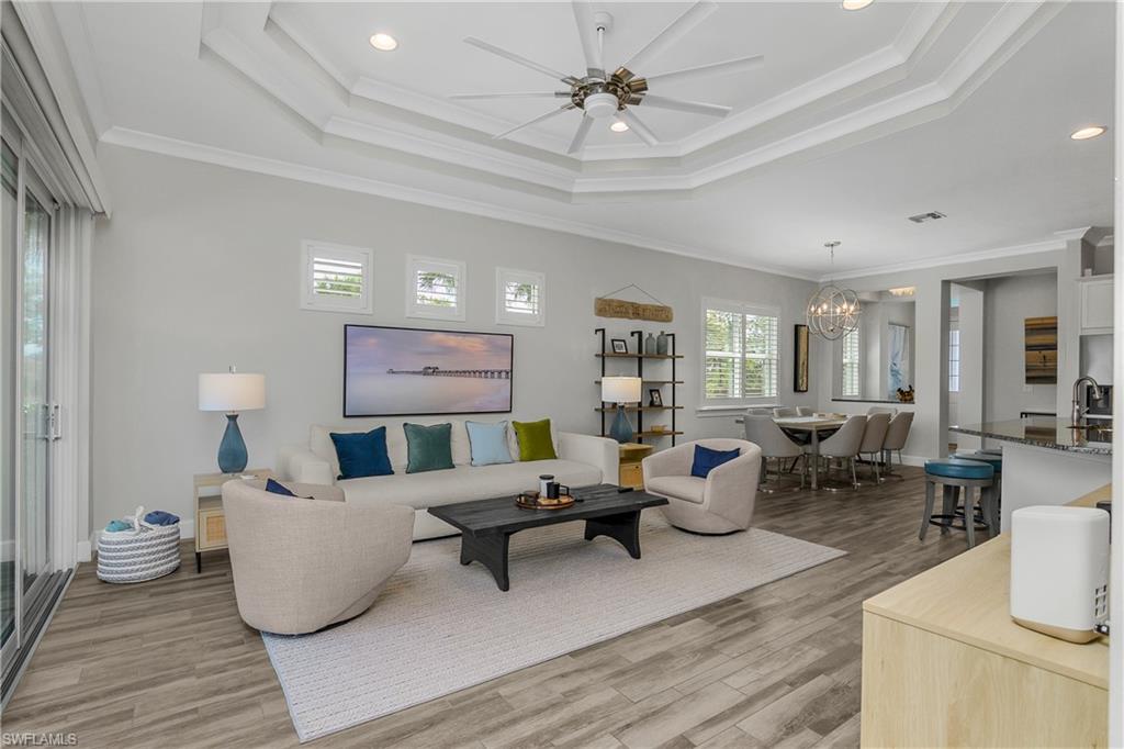 6907 Cay Court Naples, FL 34113 - Photo 22 of 50 Another angle of the great room, this one looking towards the entry.