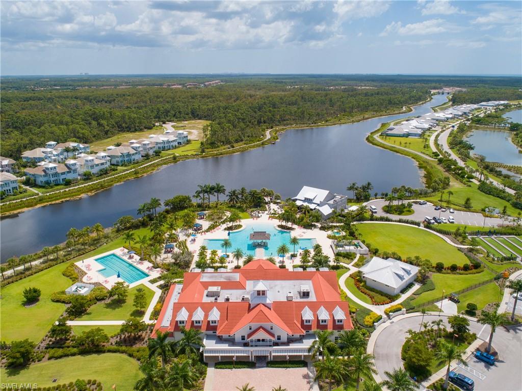 6907 Cay Court Naples, FL 34113 - Photo 43 of 50 Bird's eye view of the Clubhouse, Lap Pool on the right, community pool center, Cypress Water Way.