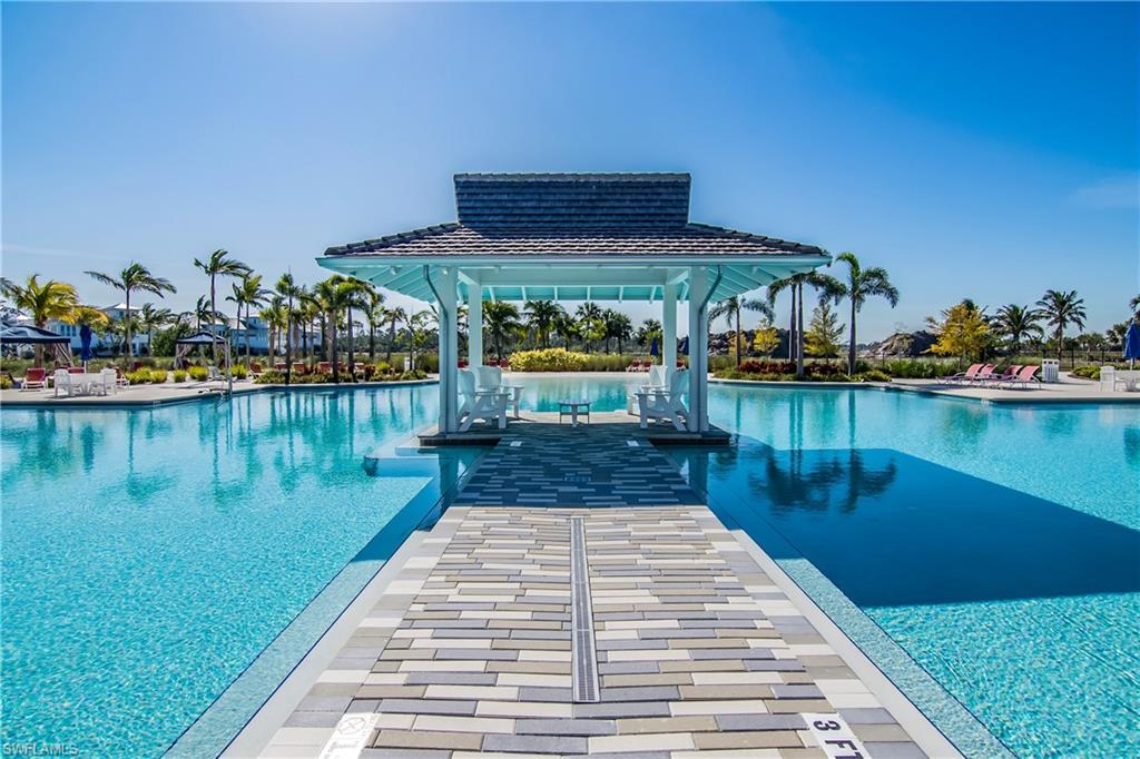 6907 Cay Court Naples, FL 34113 - Photo 44 of 50 Community pool features a lot of deck space, a gazebo, cabanas, and spa.
