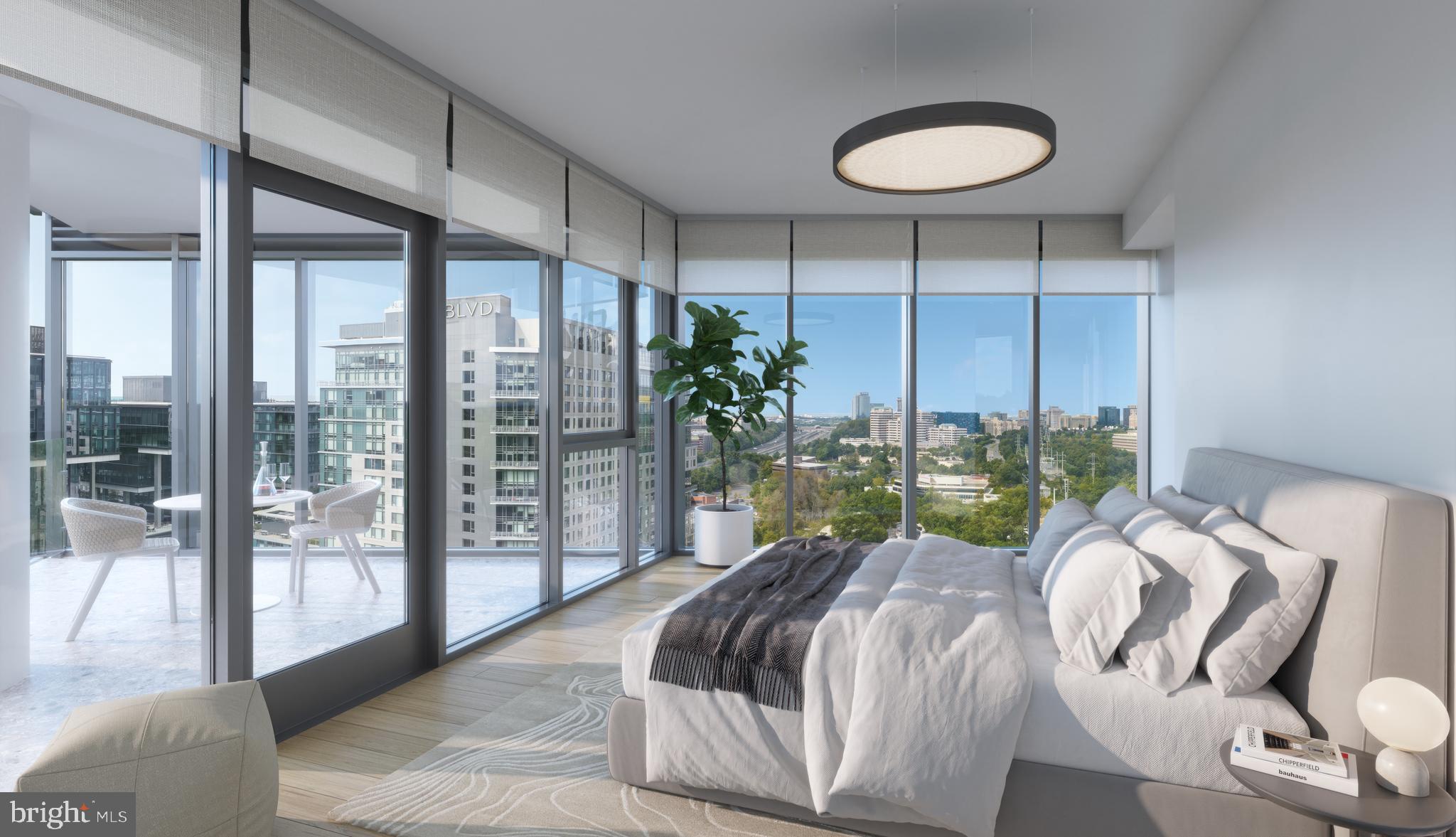 1820 Reston Row Plaza, Unit 1604 Reston, VA 20190 - Photo 7 of 9 a bed sitting in a bedroom next to a large window