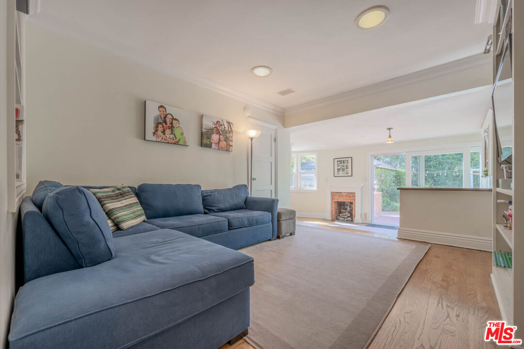 9038 Cresta Drive Los Angeles, CA 90035 - Photo 16 of 23 a living room with furniture and a large window