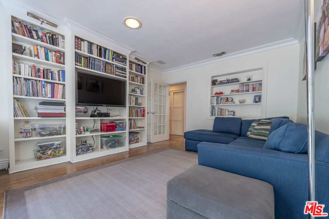 9038 Cresta Drive Los Angeles, CA 90035 - Photo 17 of 23 a living room with furniture and a flat screen tv