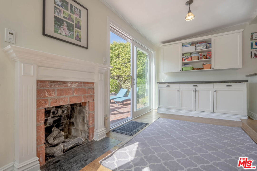 9038 Cresta Drive Los Angeles, CA 90035 - Photo 18 of 23 a view of an empty room with window and fire place