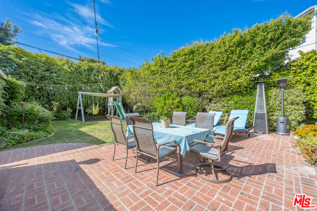 9038 Cresta Drive Los Angeles, CA 90035 - Photo 20 of 23 a view of a table and chairs in backyard yard