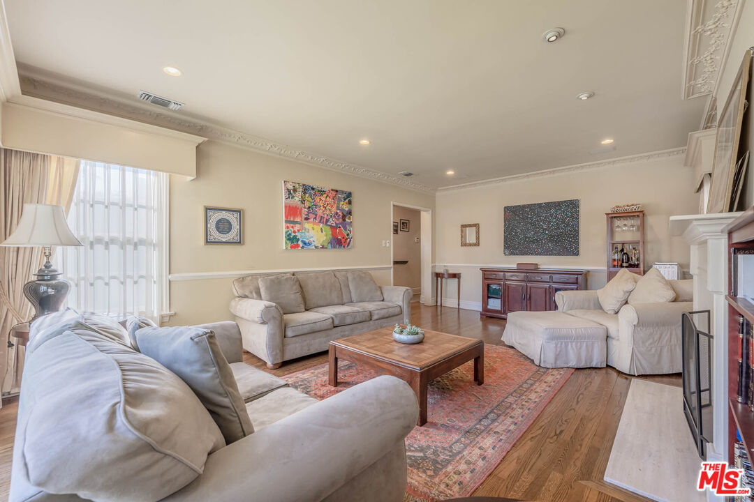 9038 Cresta Drive Los Angeles, CA 90035 - Photo 3 of 23 a living room with furniture or couch and a wooden floor