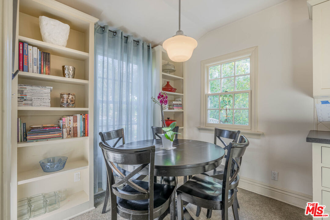 9038 Cresta Drive Los Angeles, CA 90035 - Photo 6 of 23 a view of a dining room with furniture and a window