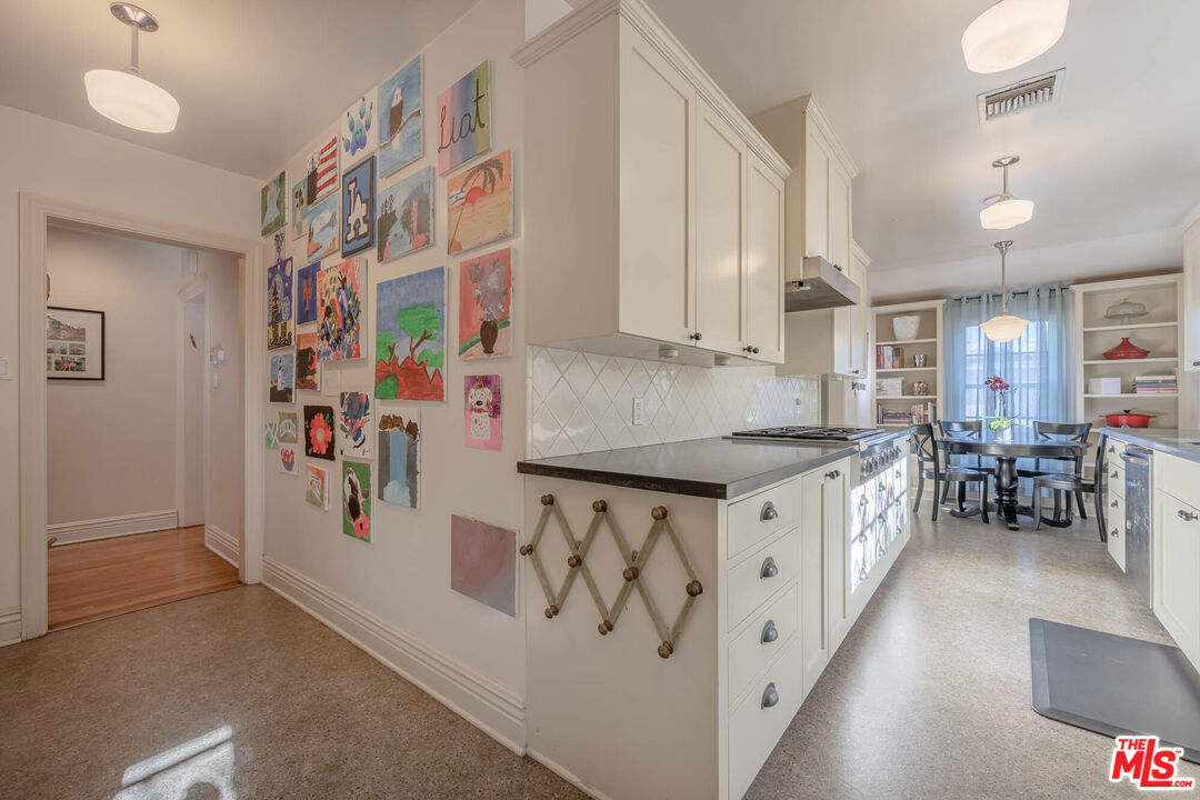 9038 Cresta Drive Los Angeles, CA 90035 - Photo 9 of 23 a kitchen with stainless steel appliances granite countertop a stove and a refrigerator