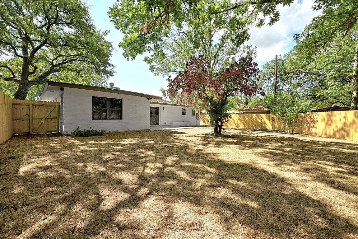 4604 Nevada Path Austin, TX 78745 - Photo 9 of 10 a view of a house with a backyard