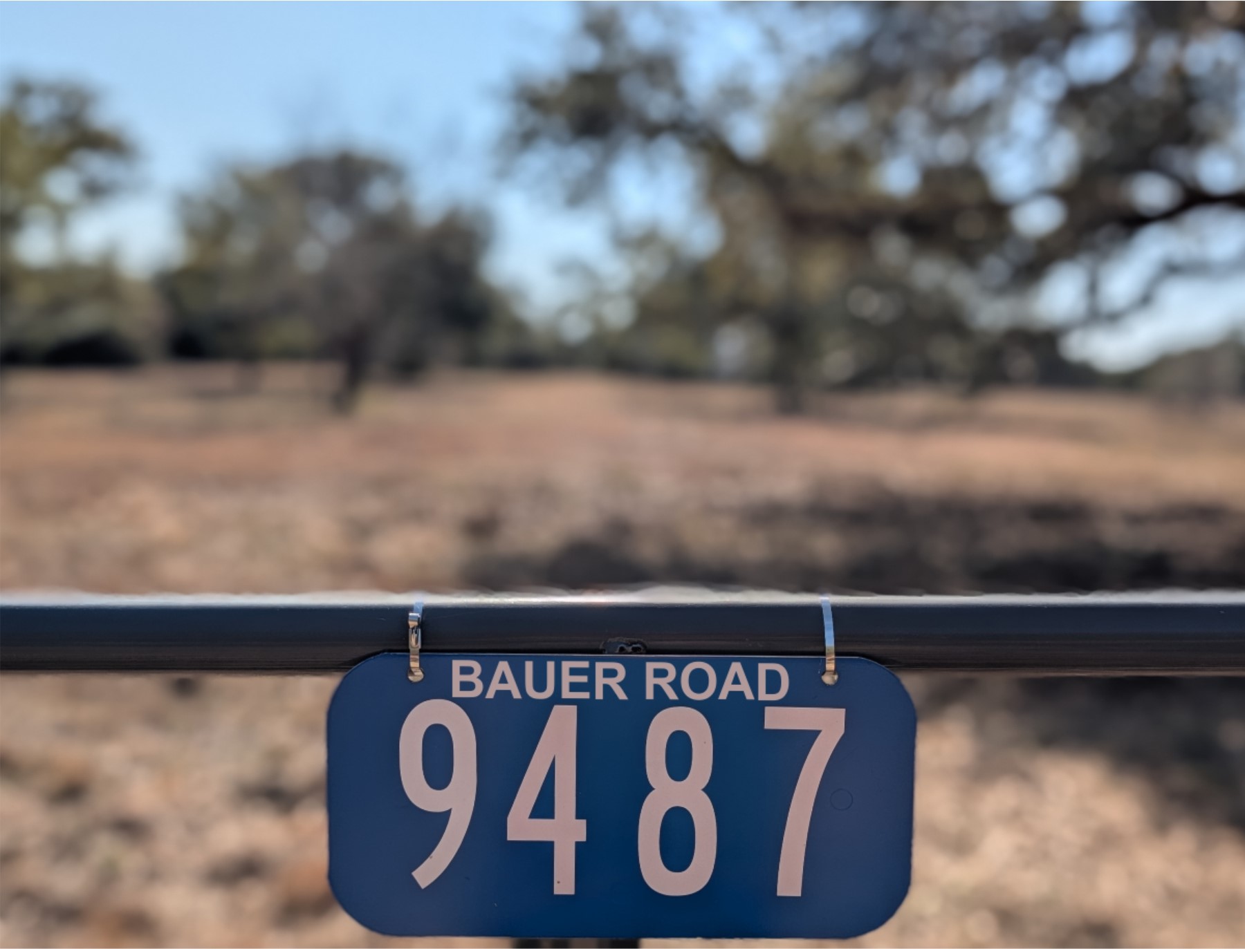 9487 Bauer Road Fayetteville, TX 78940 - Photo 2 of 16 a close up of a street sign