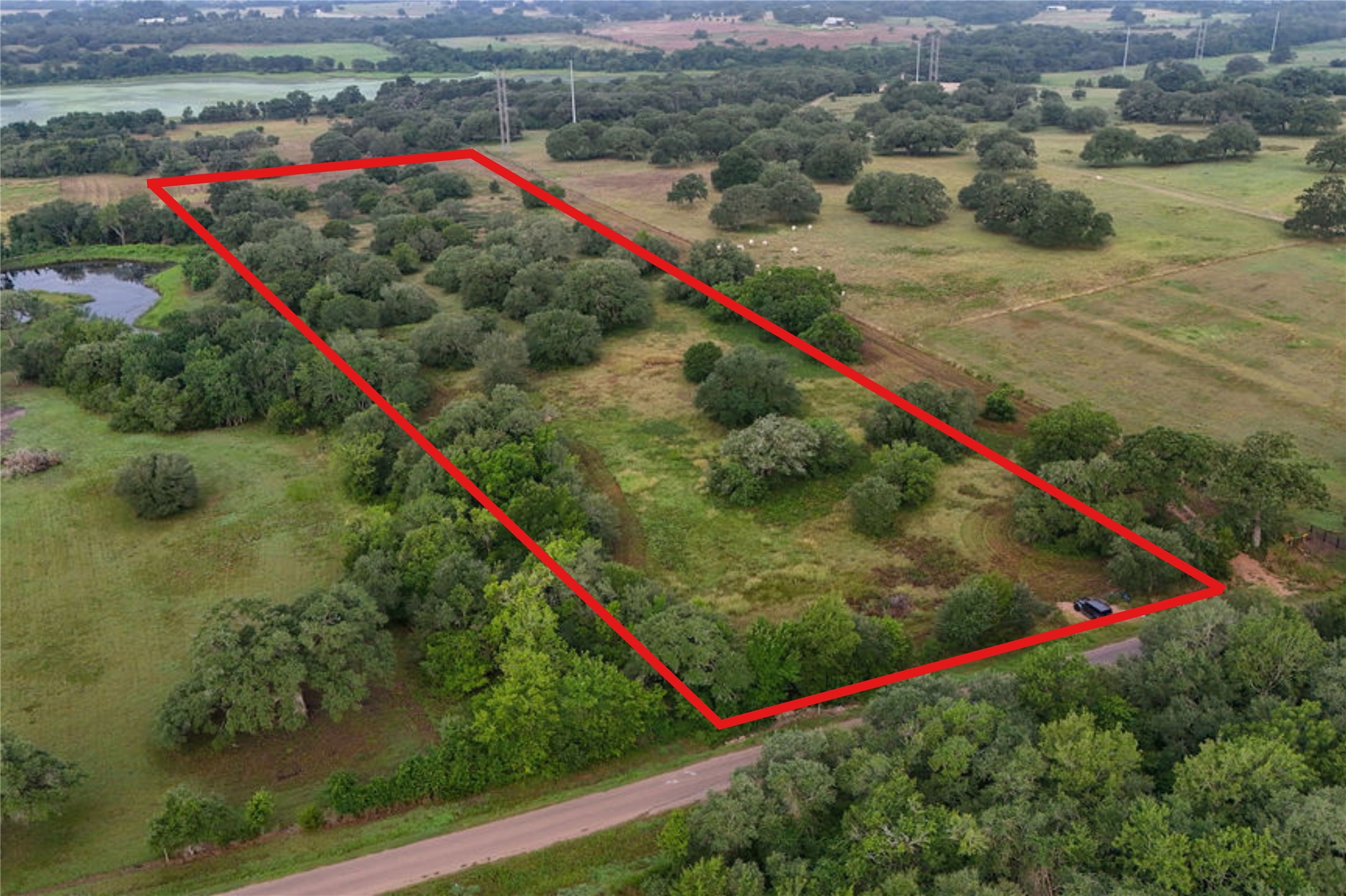 9487 Bauer Road Fayetteville, TX 78940 - Photo 10 of 16 a view of a yard with a lake