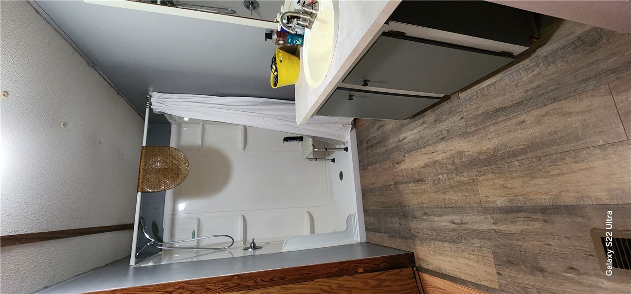326 Doyle Street Westminster, SC 29693 - Photo 11 of 26 This bathroom features a functional shower and a practical vanity with ample counter space.