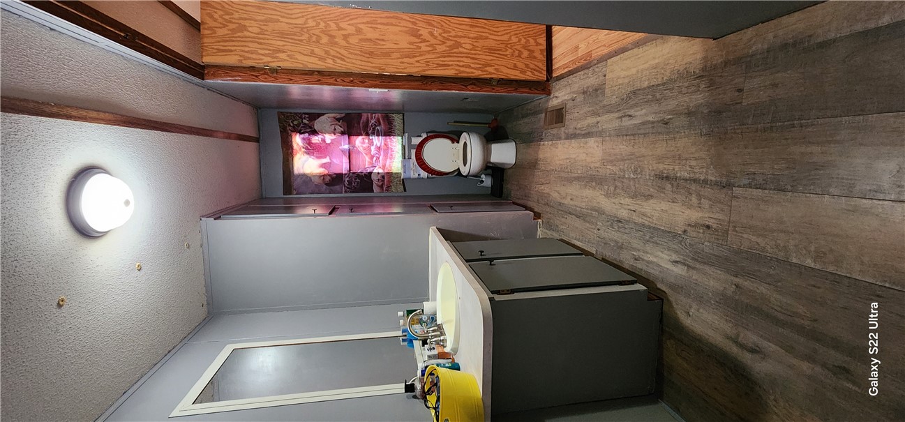 326 Doyle Street Westminster, SC 29693 - Photo 12 of 26 This bathroom features durable vinyl plank flooring and a vanity with a sink.